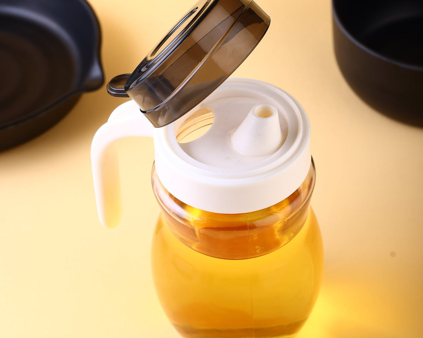 Steel oil bottle with easy pour spout.