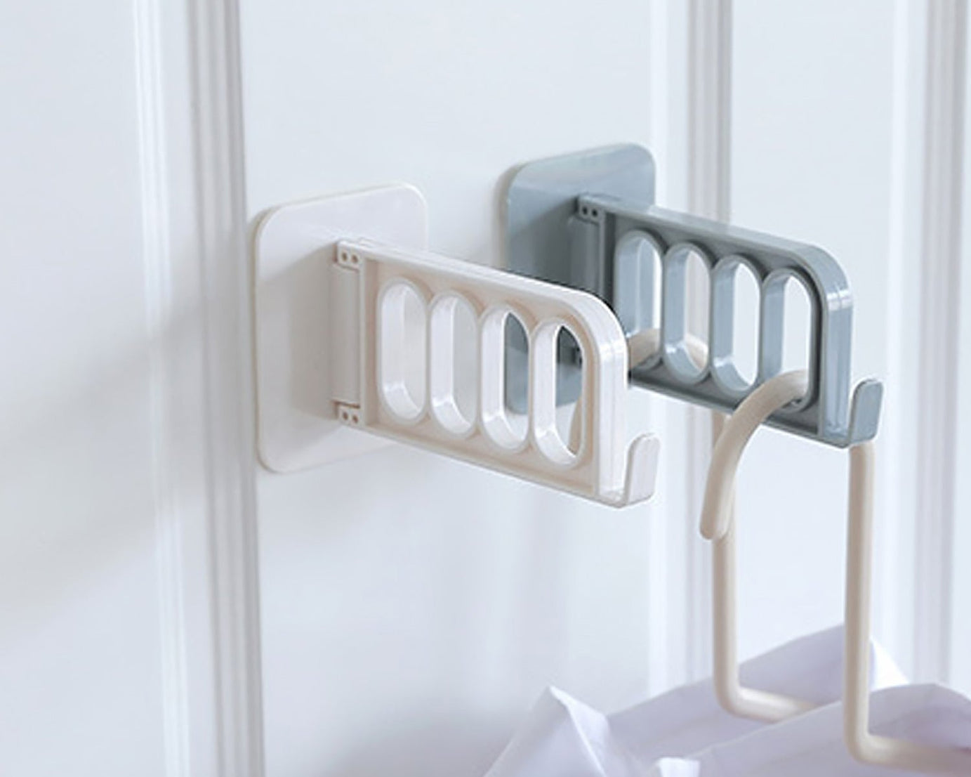 Simple door hook for various uses in bathroom, kitchen, or bedroom.