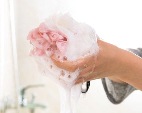 Round loofah sponge for exfoliating and scrubbing