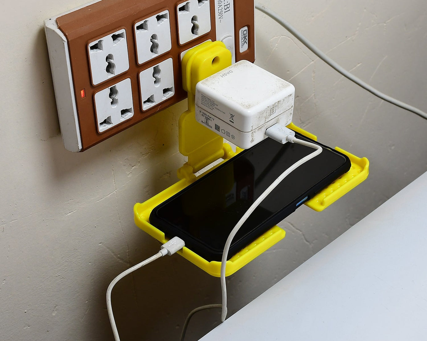 Wall holder stand for charging mobile.