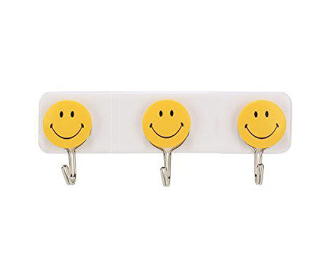 Colorful smiley face hooks for decorative wall hanging.
