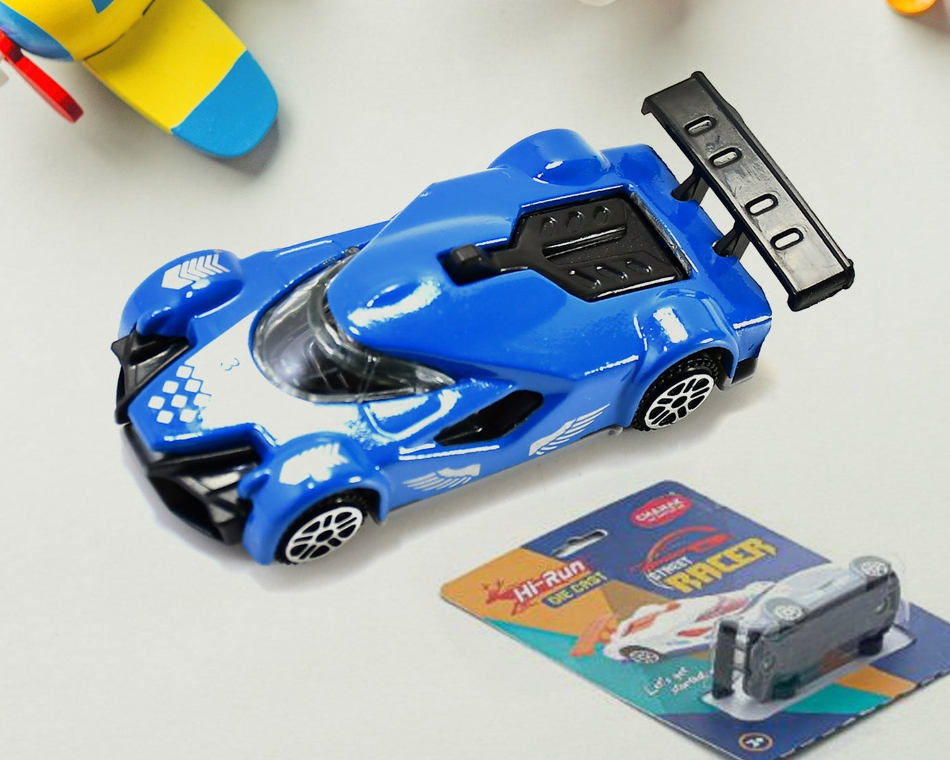 Die-cast metal race car toy, close-up, 3+ years