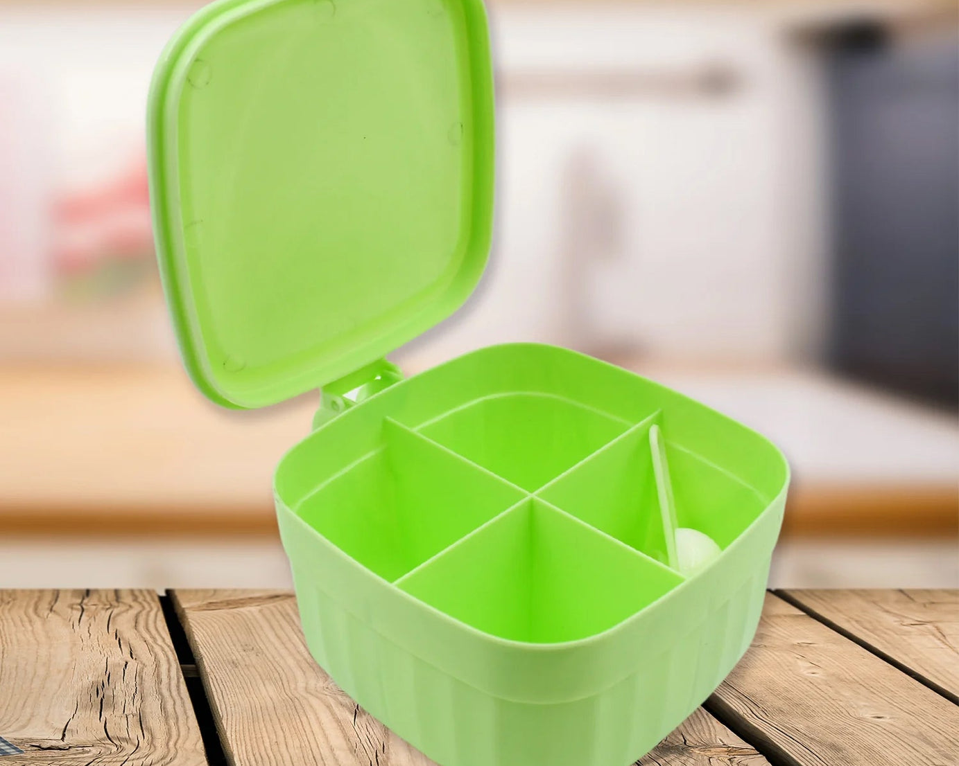 Four-section masala box designed for organizing different spices with a decorative design.