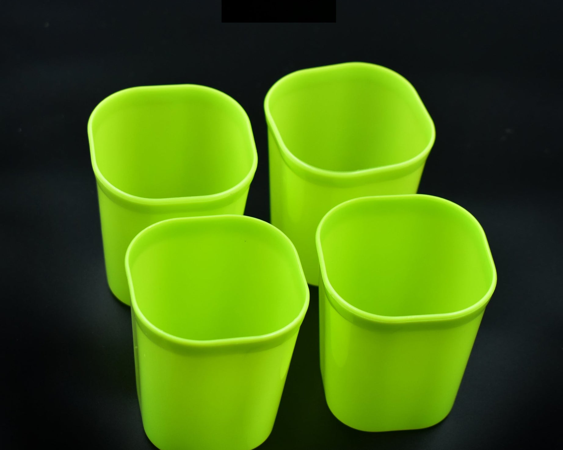 Set of 4 unbreakable plastic glasses for juice, water, milk.