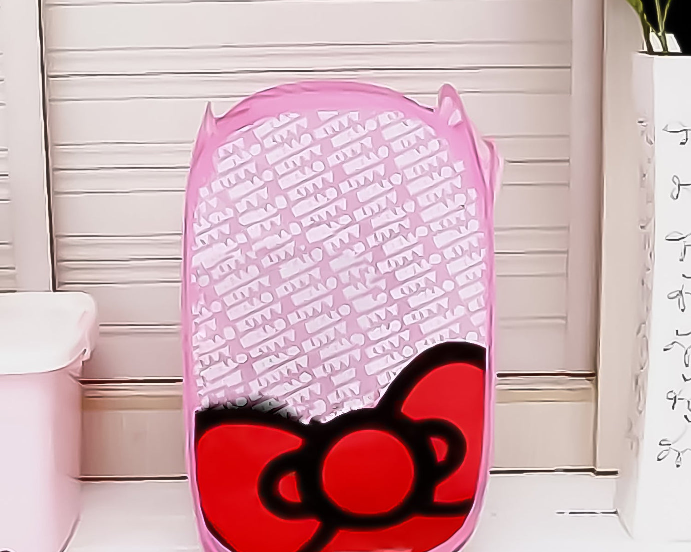 Waterproof canvas laundry bag with stylish print for home organization.