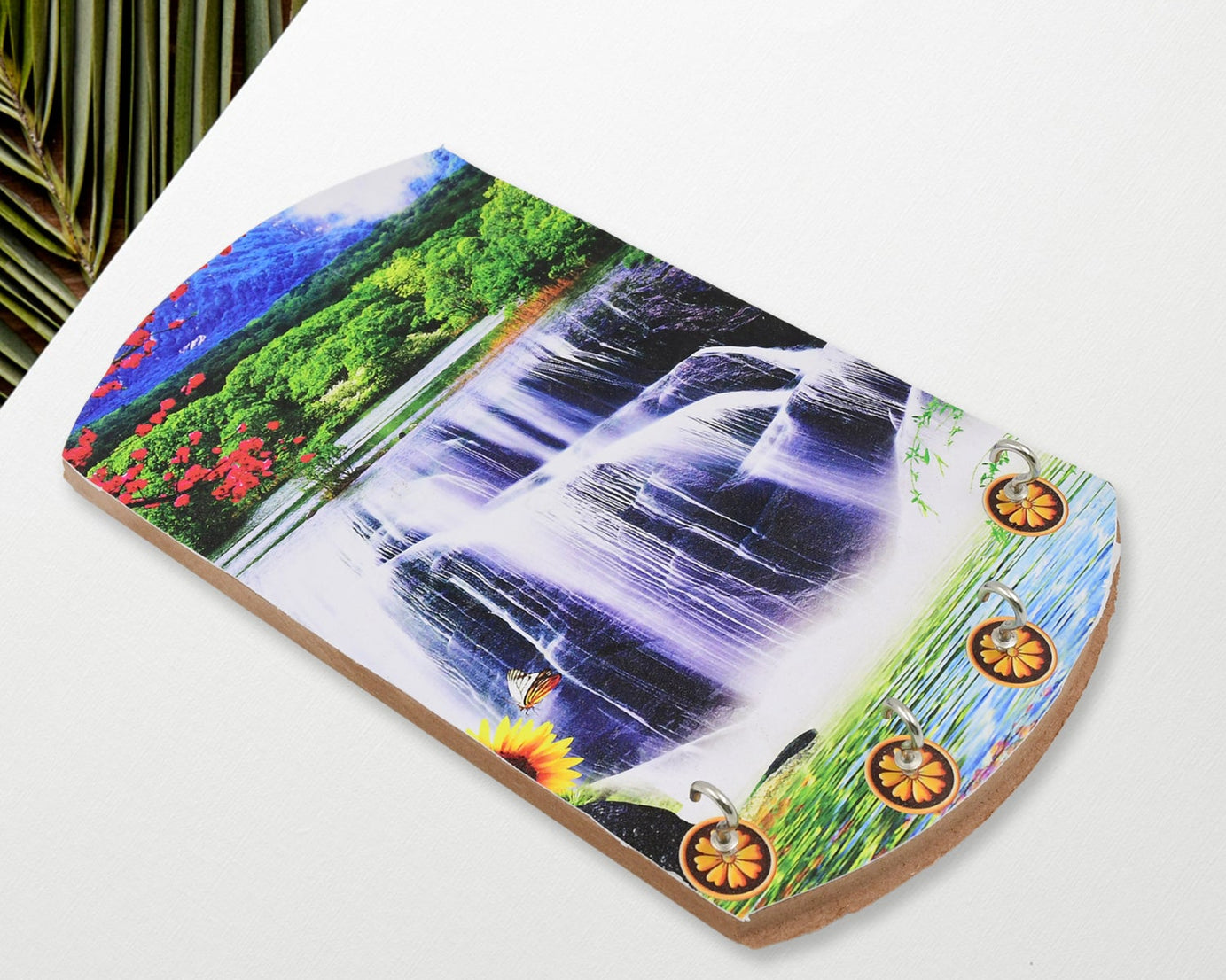 Decorative wooden wall hanging with vertical scenery and hooks.