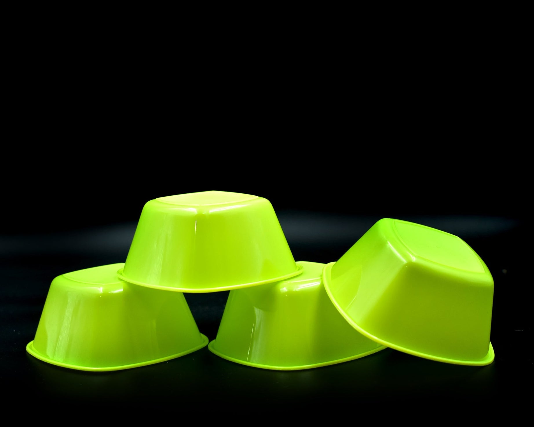 Pack of 4 plastic serving bowls, square shape.