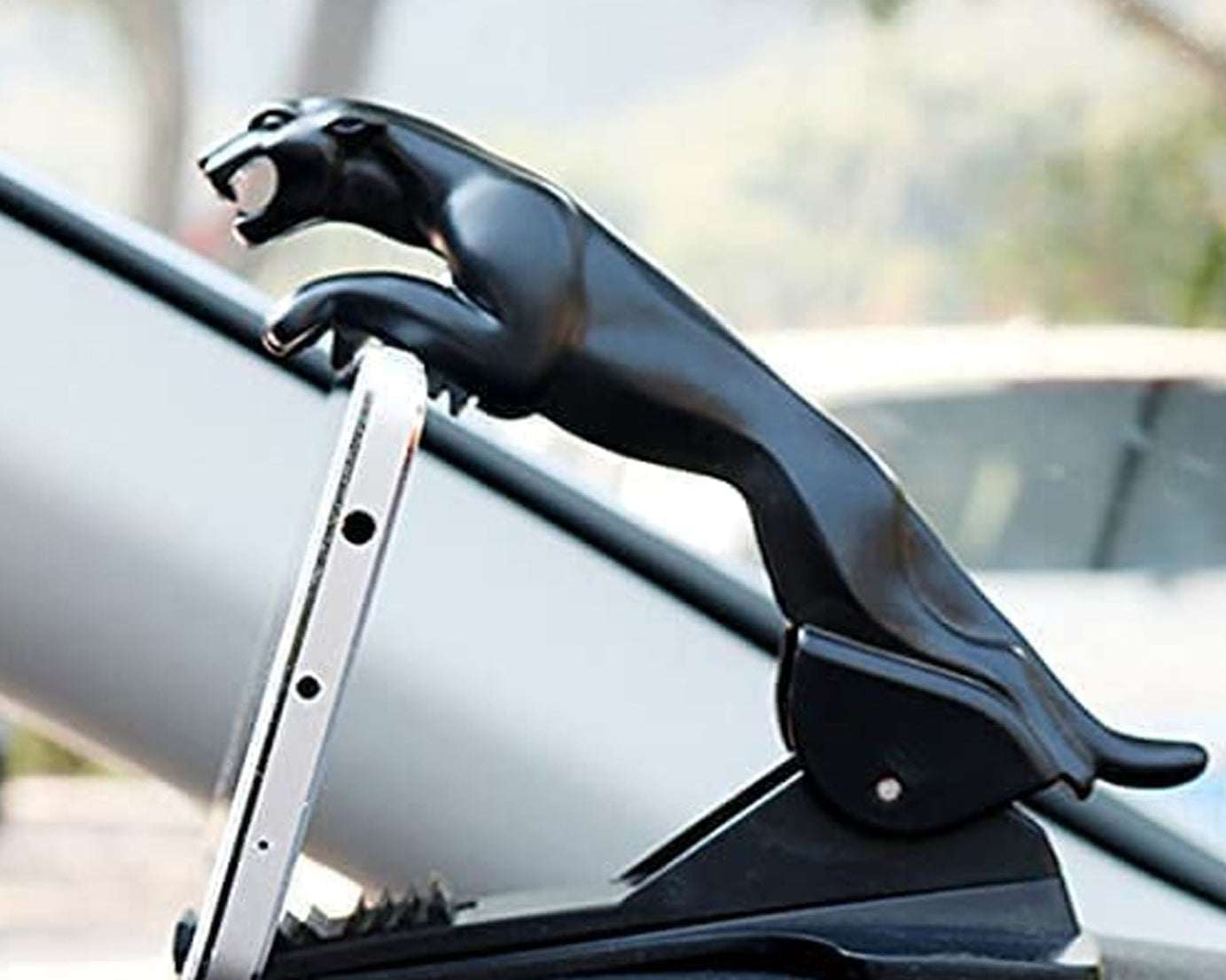 Mobile phone holder with a stylish jaguar design