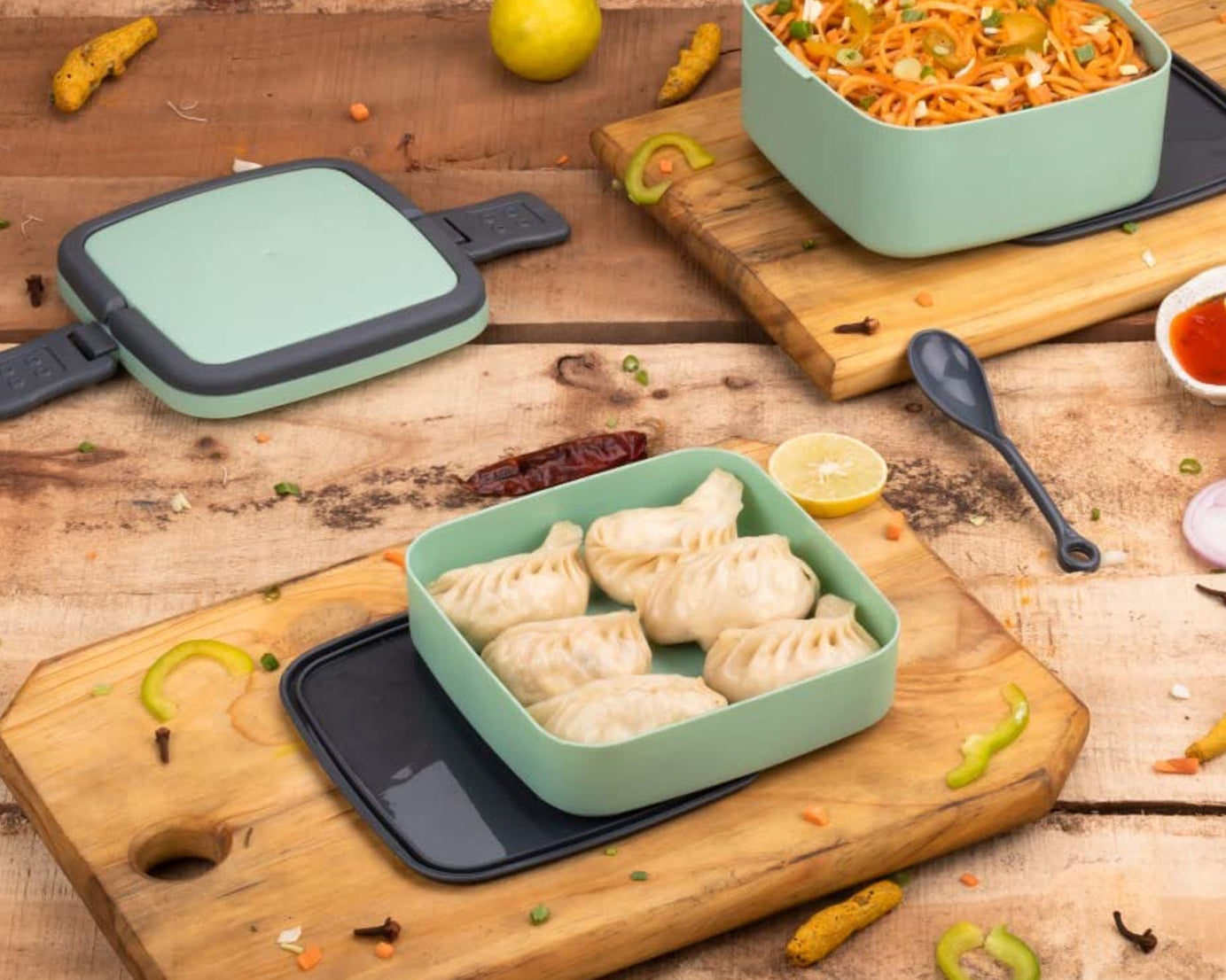 Green lunch box with handle and spoon for easy carrying