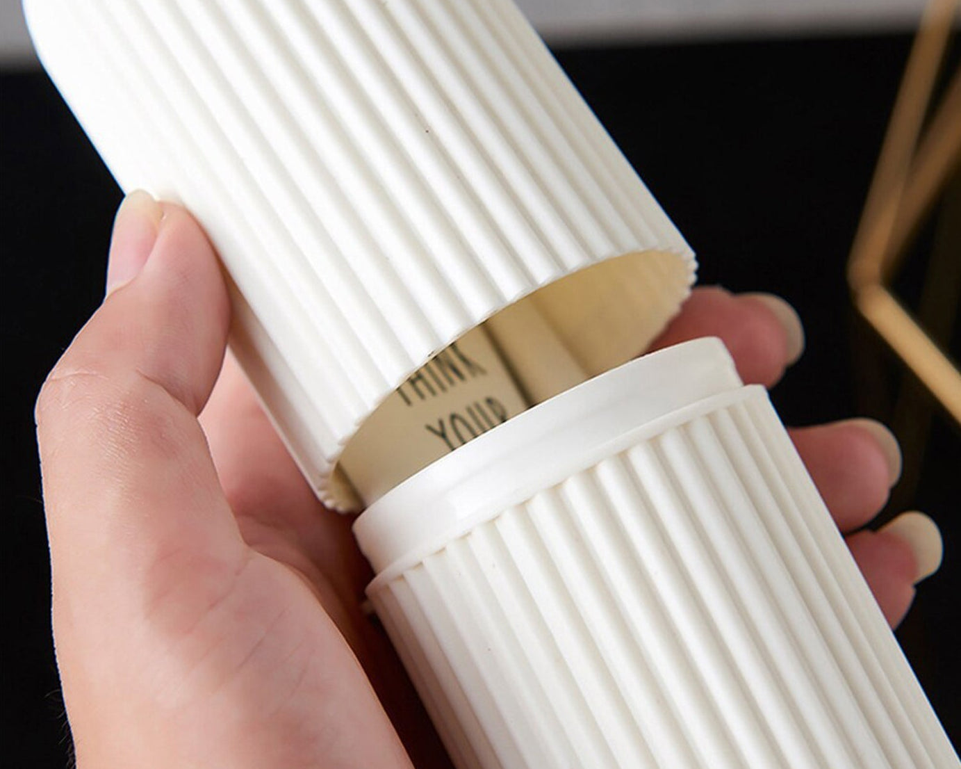 Close-up of capsule-shaped travel storage bottle