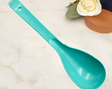 Plastic serving spoon.