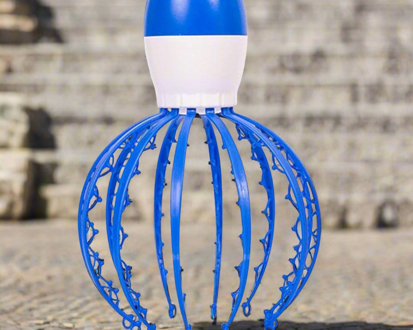 Electric scalp massager in octopus design.