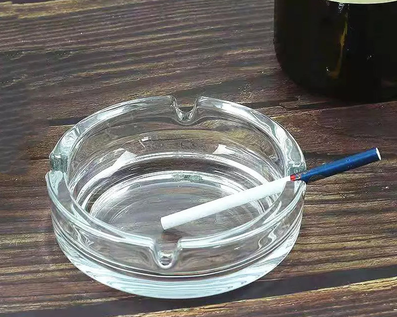 Classic crystal glass ashtray for tabletop decor.