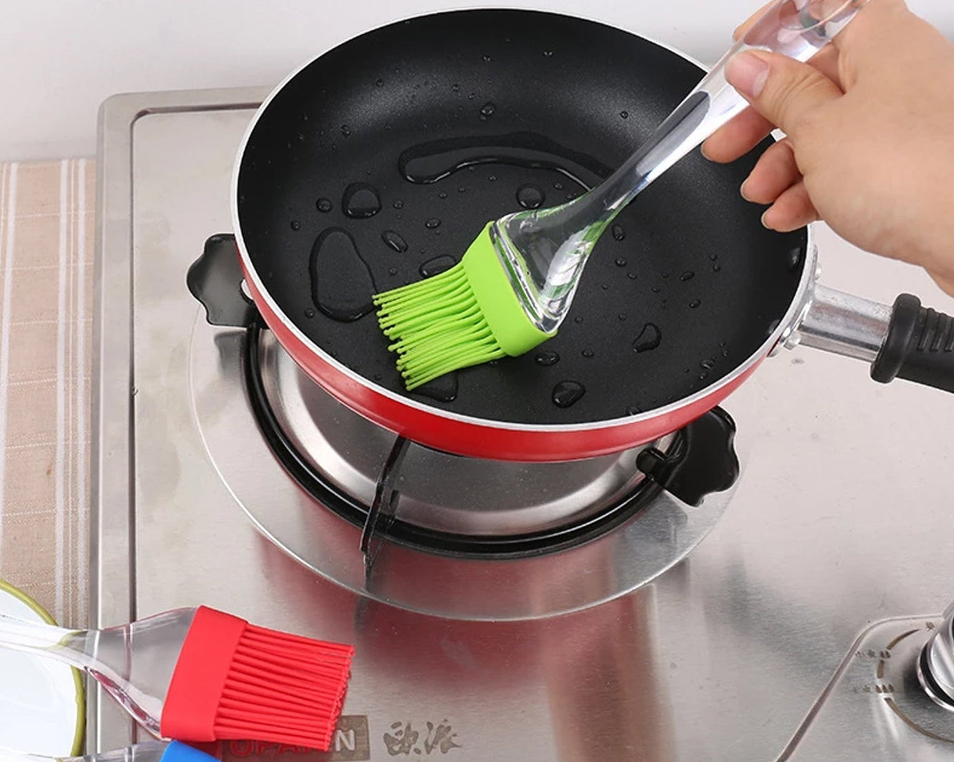 Pastry brush and spatula for baking and cooking tasks.