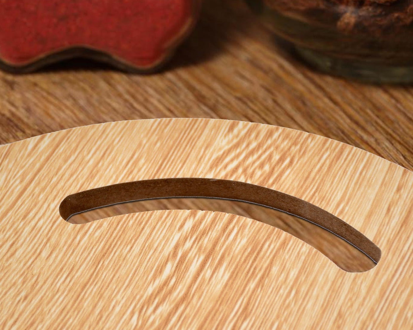 Small round wooden chopping board