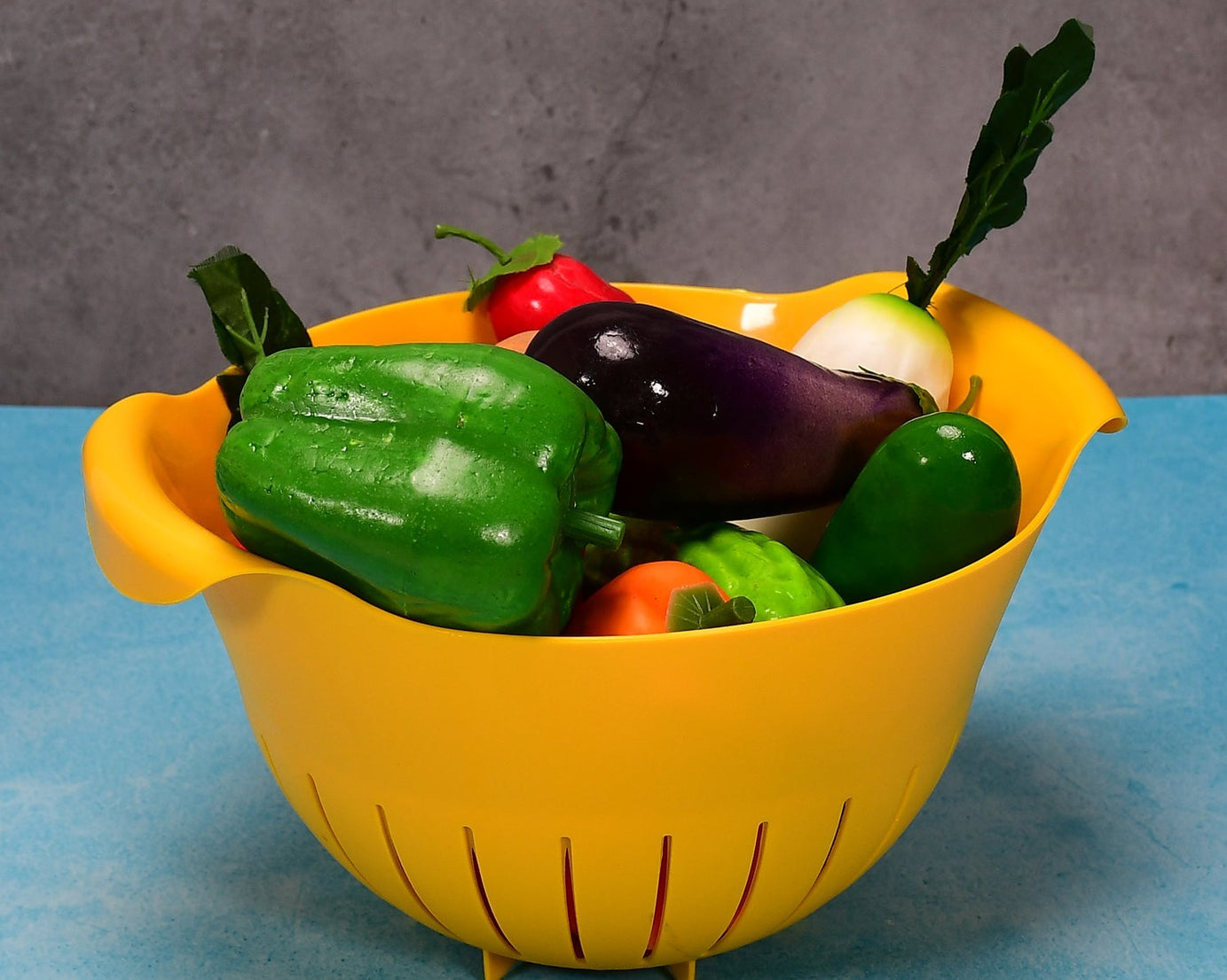 Bowl with strainer for washing fruits and veggies.