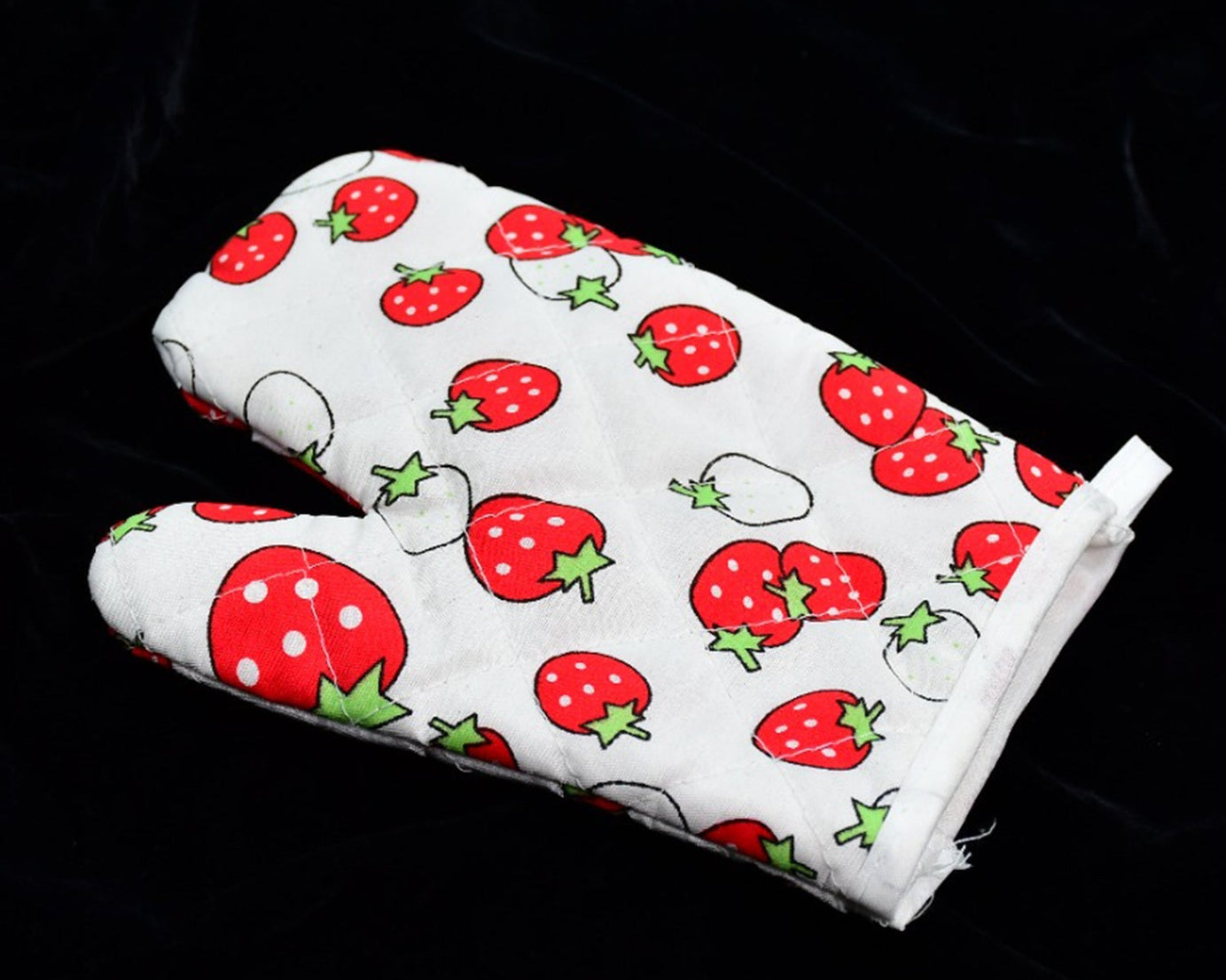 Colorful designer oven mitt and pot holder set, perfect for kitchen use.
