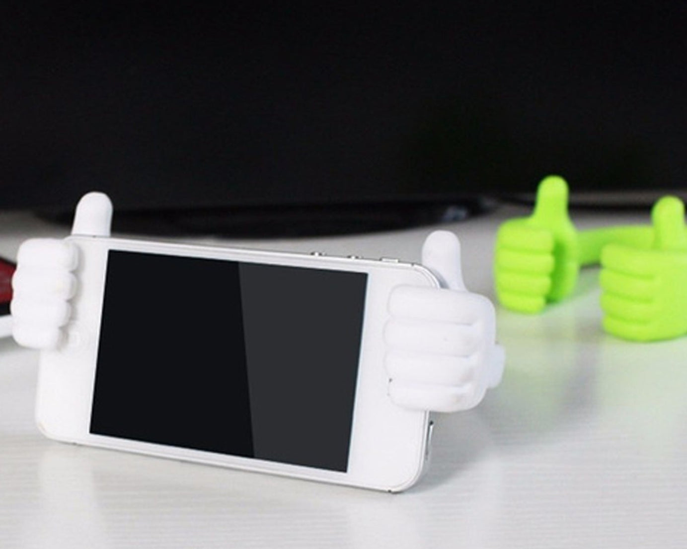 Hand design mobile stand for providing stable phone support.