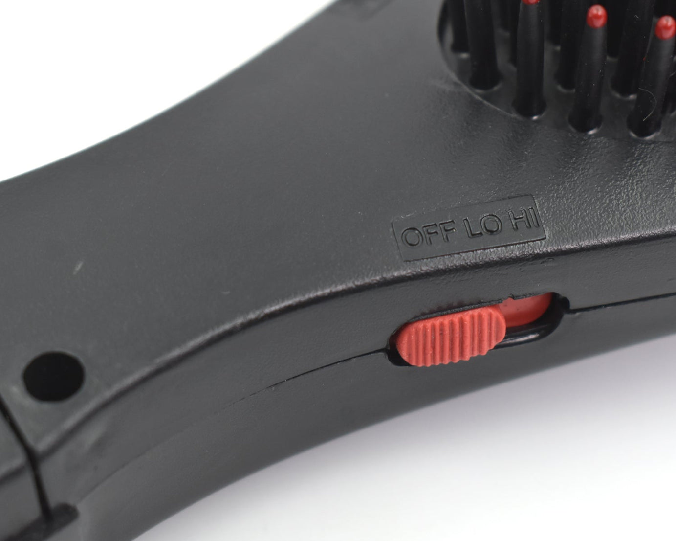 Vibrating massager comb for hair, electric brush with massage feature.