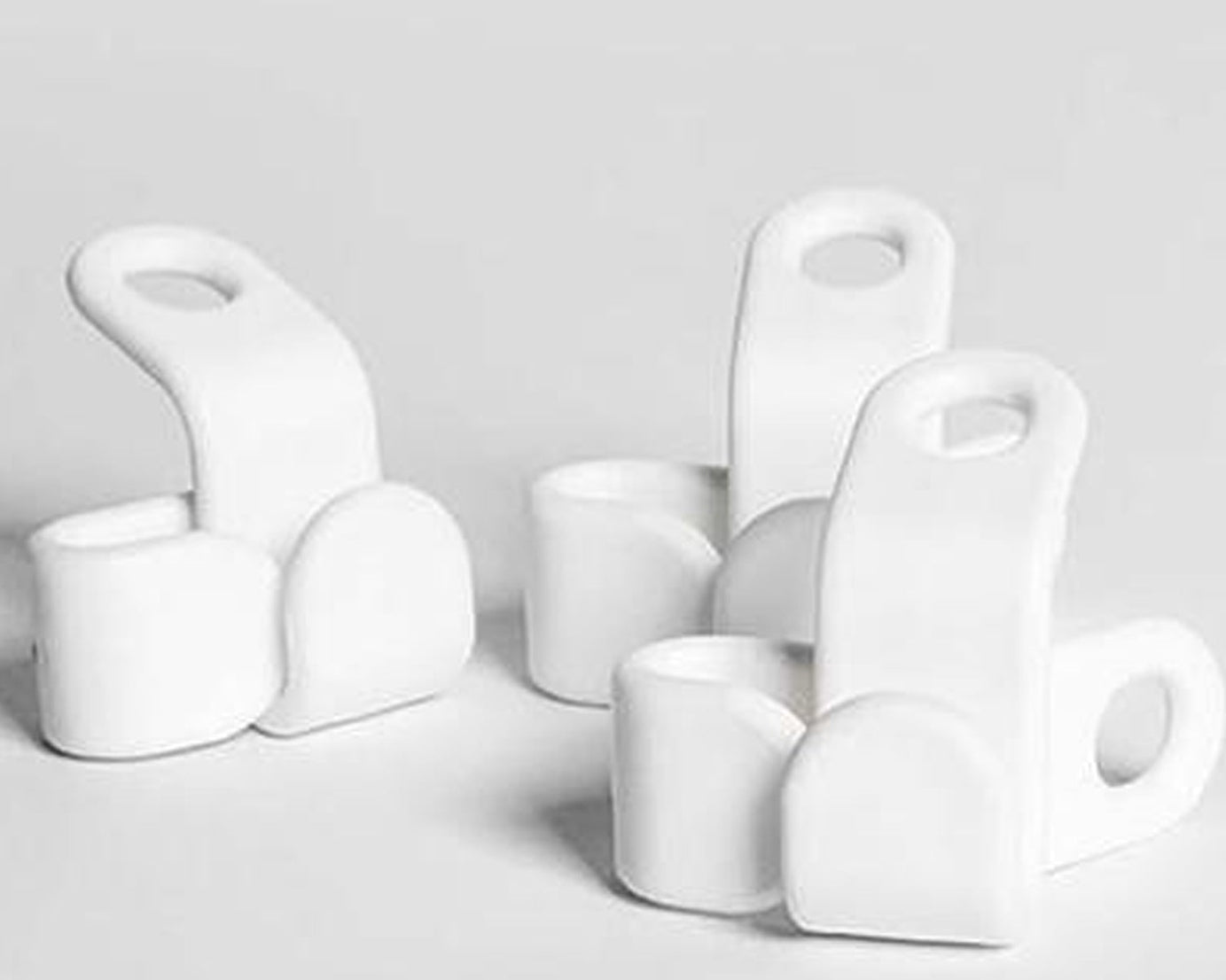 Set of plastic hangers with non-slip pads.
