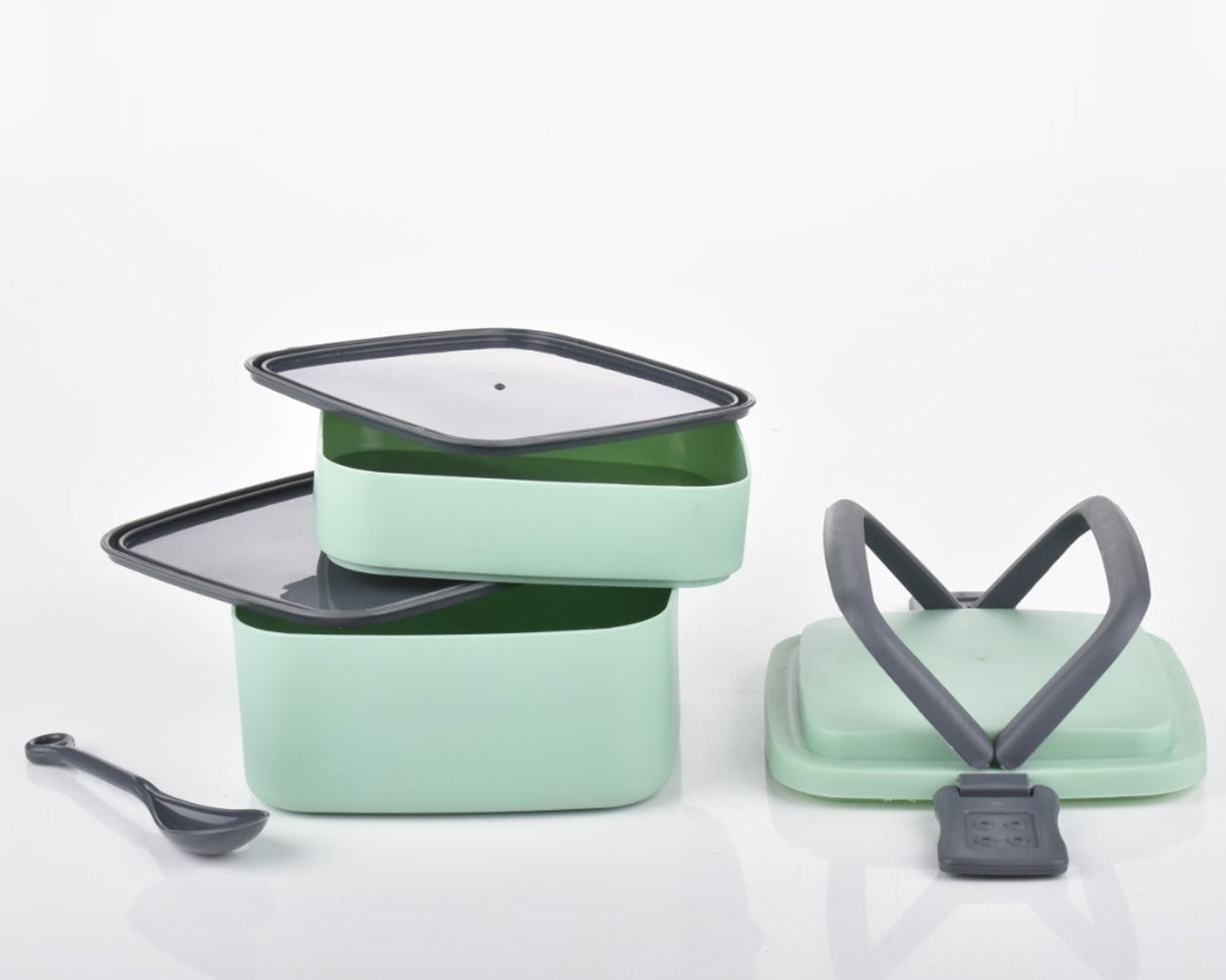Green bento box with handle and spoon for convenience