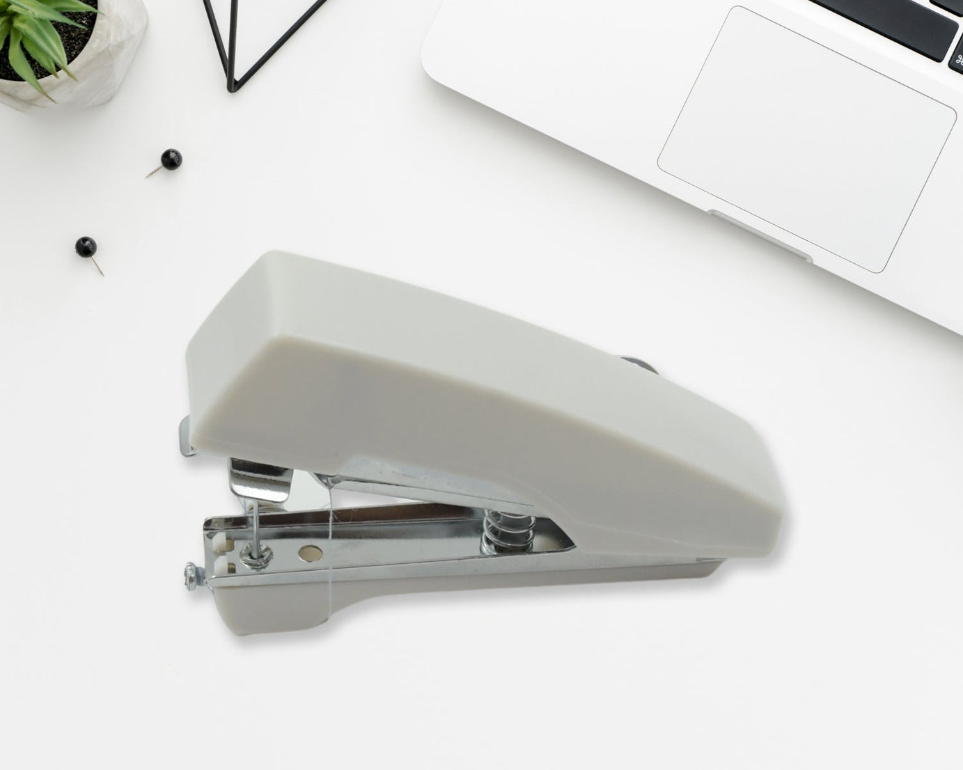 Pocket-sized manual sewing stapler