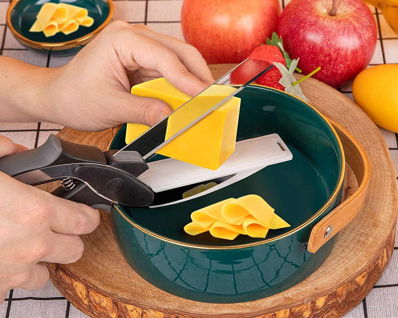 Multi-purpose chopper and slicer for fruits and vegetables with handle.