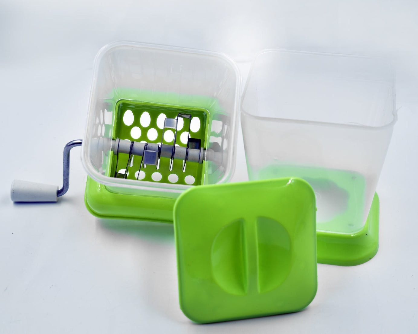 Vegetable cutter with rotating blade for chopping onions easily.