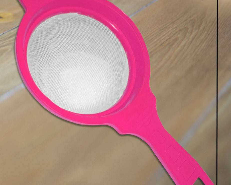 Multicolor strainers for juice, efficient for filtering liquids.