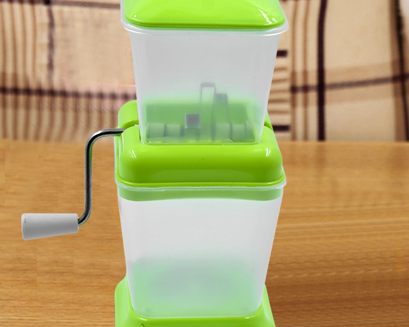 Small onion and vegetable chopper with rotating blade for fast cutting.