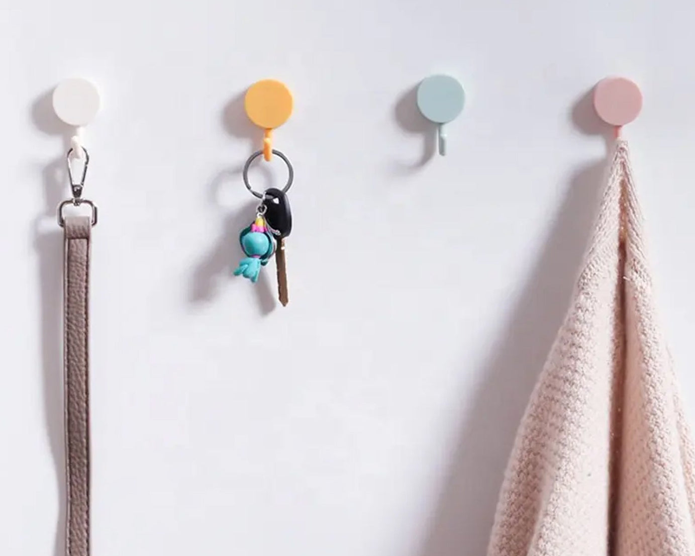 Wall hooks with adhesive backing