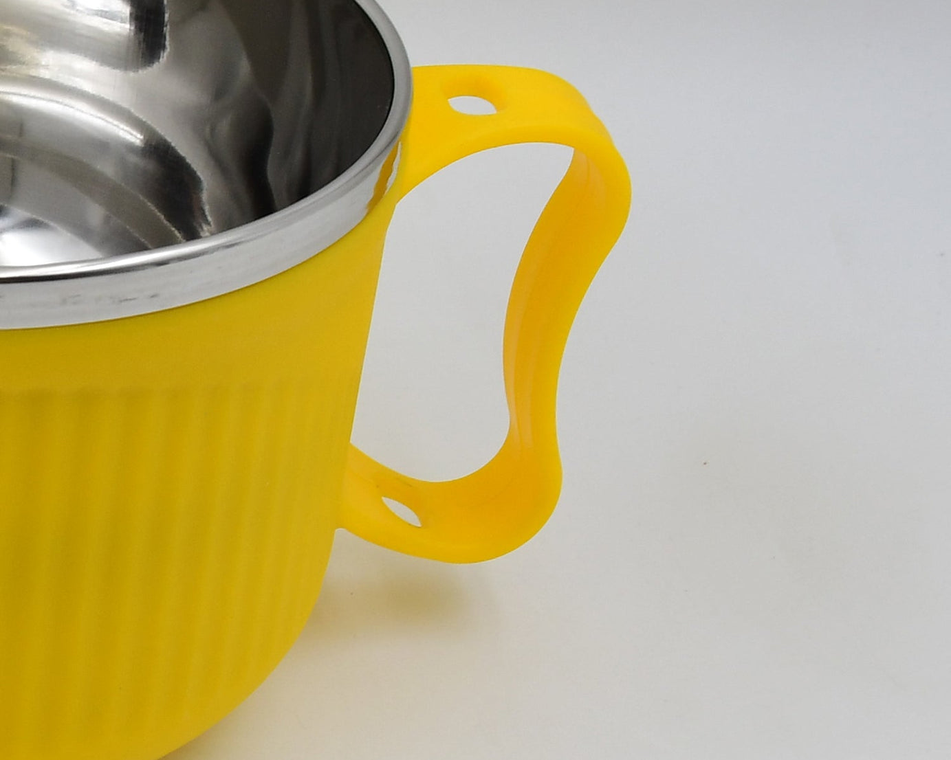 White bowl with handle and lid, designed for easy serving of breakfast cereals, soups, and beverages. Dishwasher safe.