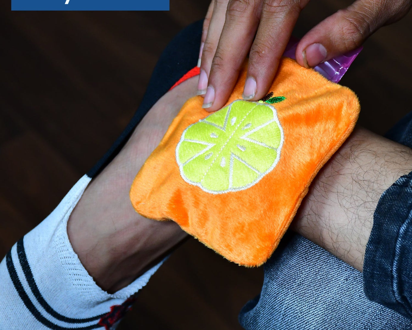 Orange hot water bag for menstrual cramps and body warmth