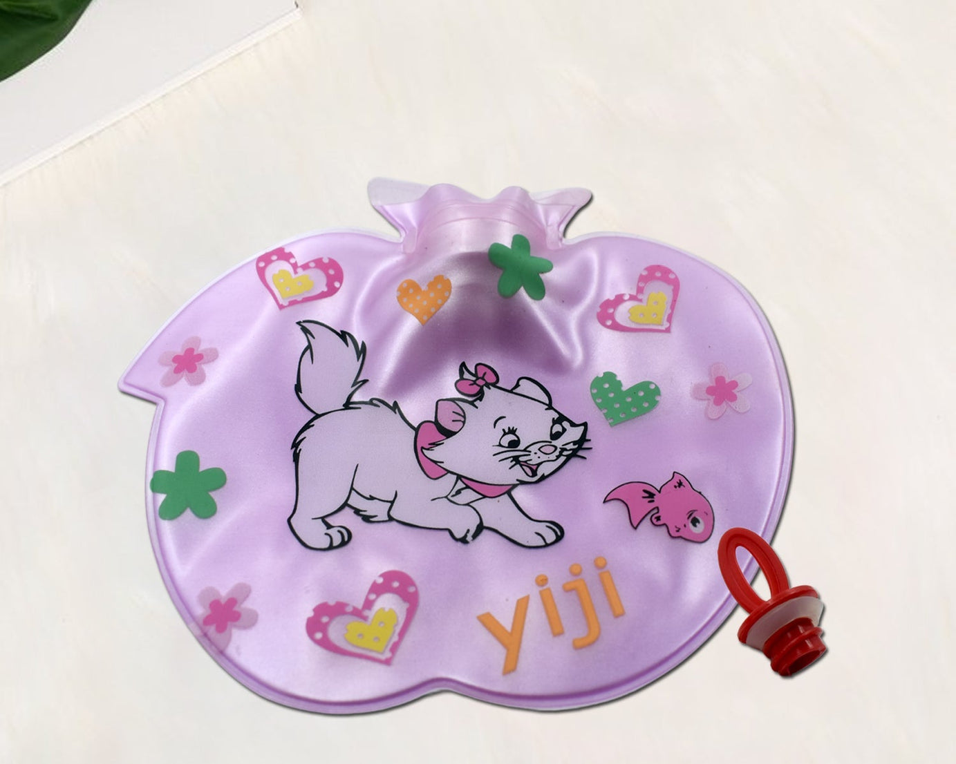 Apple-themed hot water bottle.