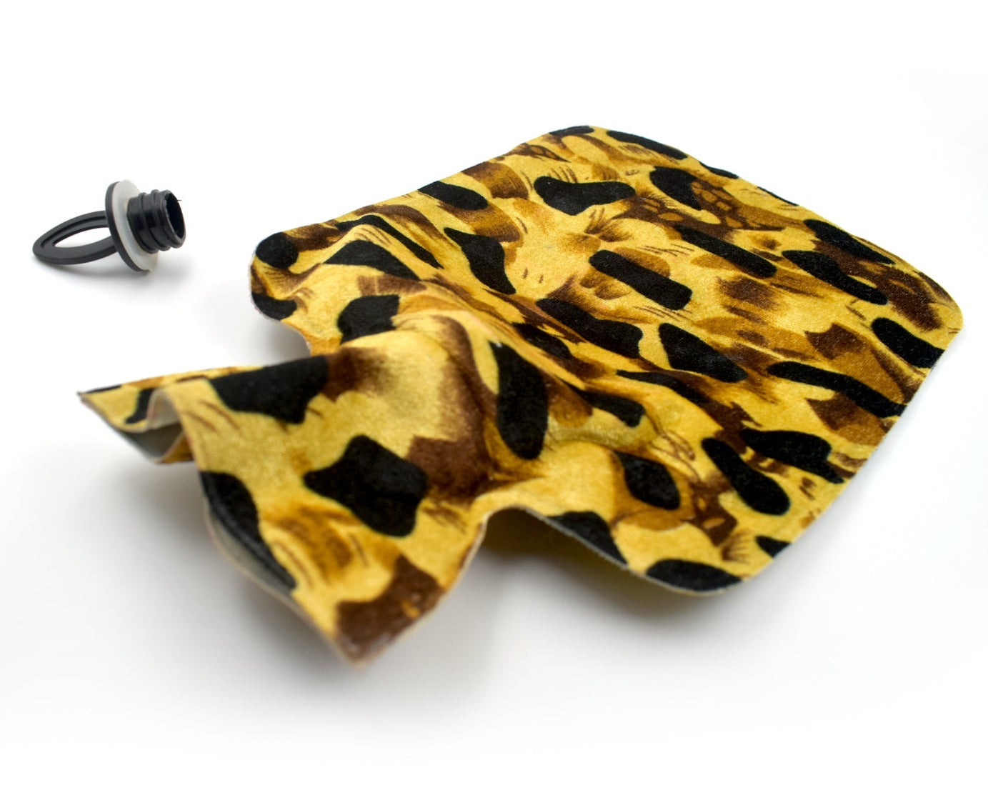 Detailed view of the heating pad's rubber surface, showing its design for holding heat