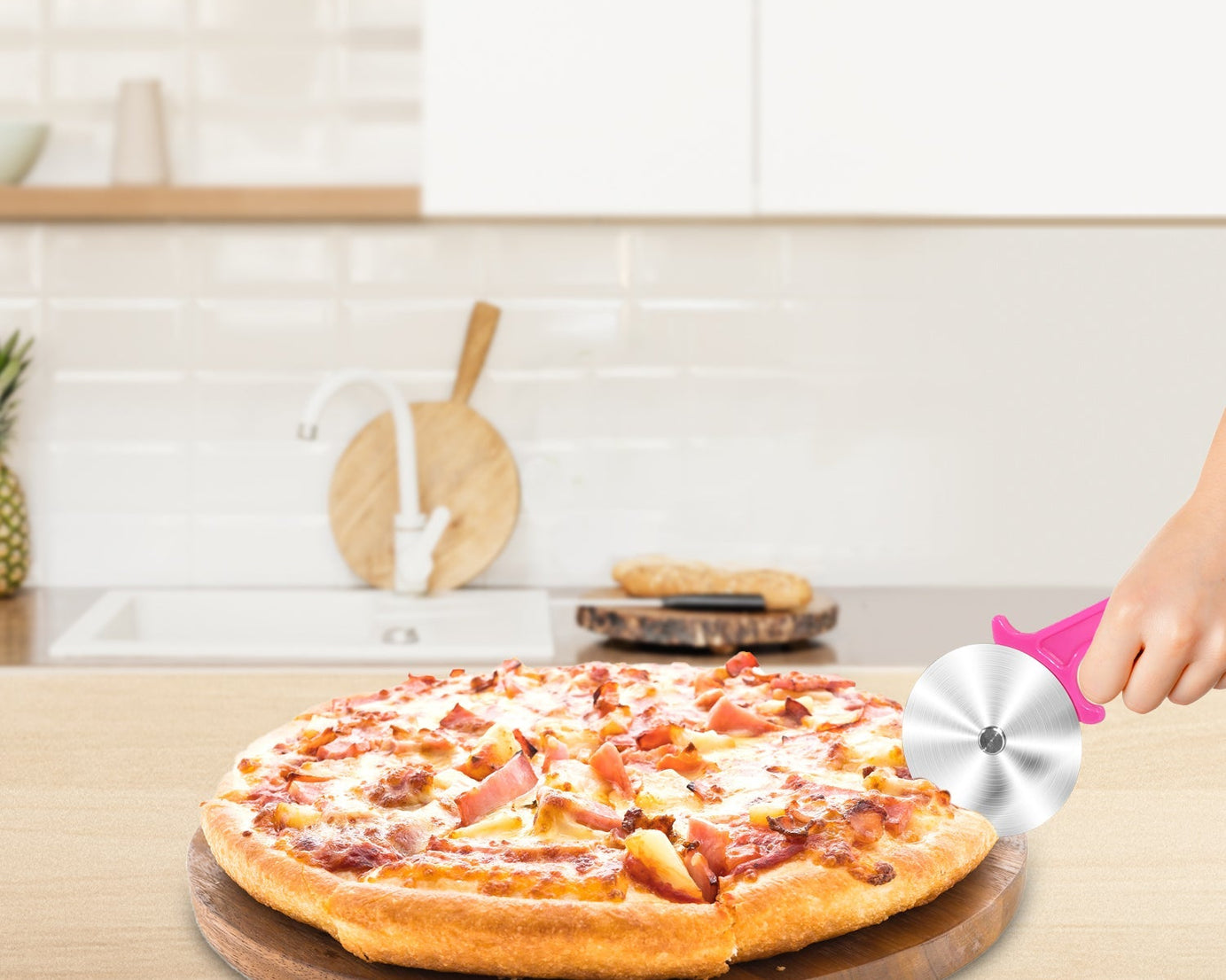 Stainless steel cutter for pizzas and sandwiches.