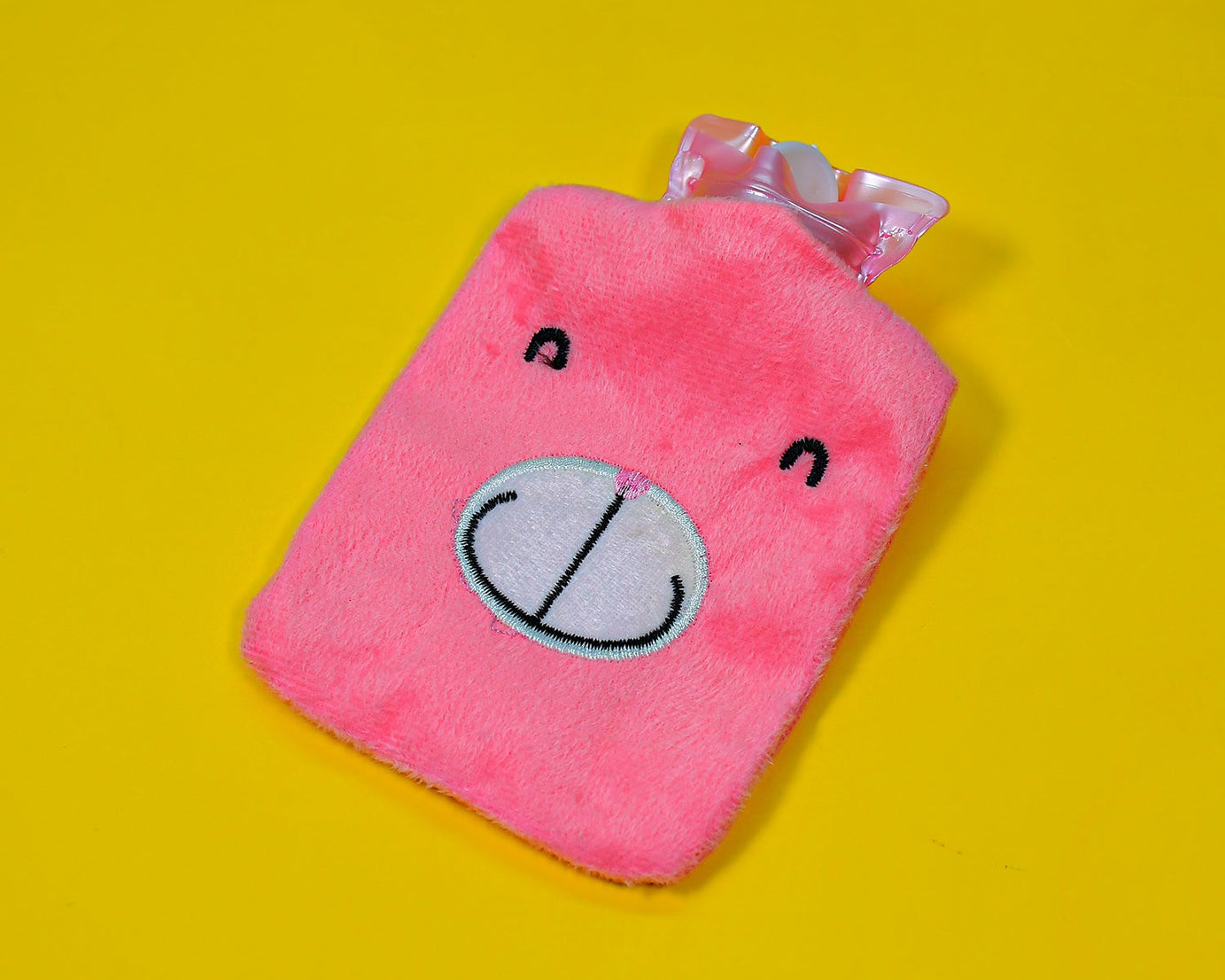 Small pink hot water bag for cramps, neck, and shoulder pain