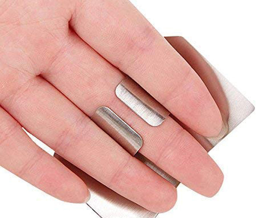 Kitchen finger guard made of stainless steel for safe chopping.