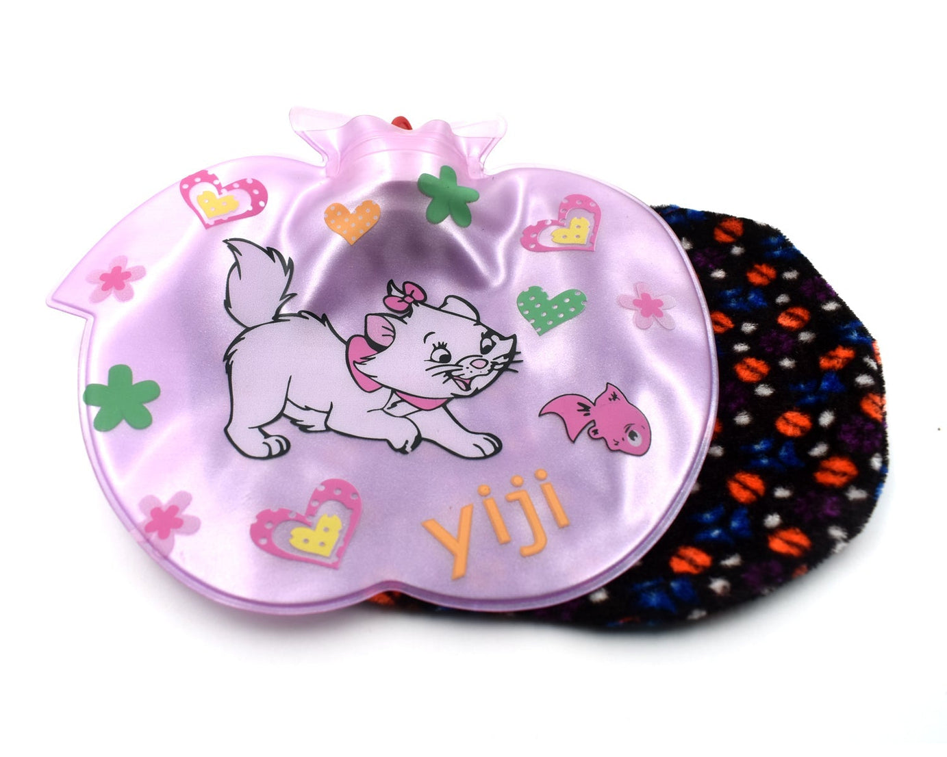 Apple-shaped hot water bottle for pain relief.