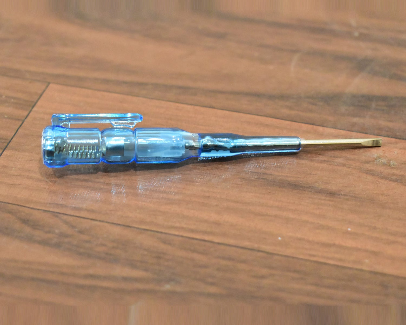 Linemen screwdriver with metal tester for electrical repairs.