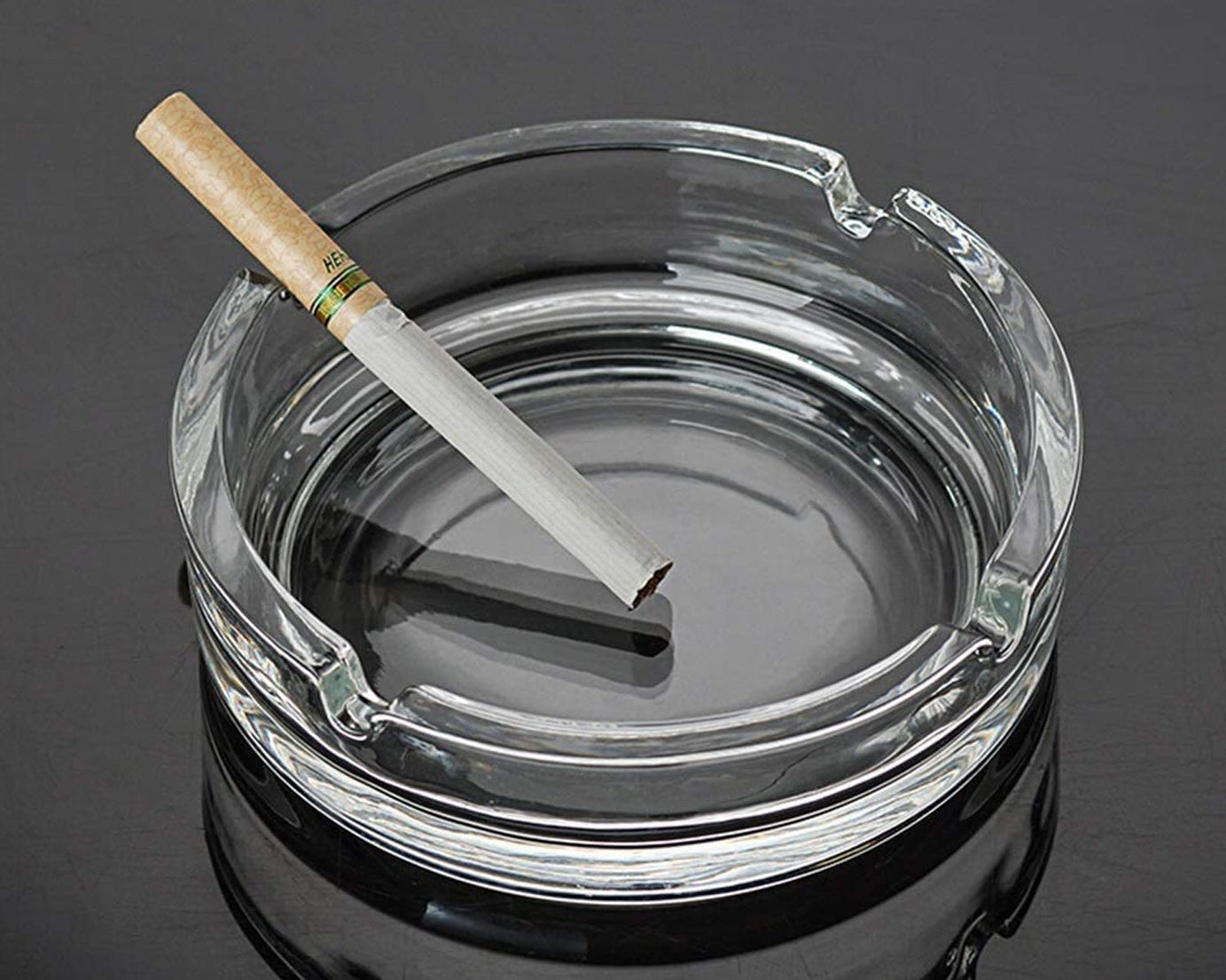 Durable crystal ashtray with a sleek design.