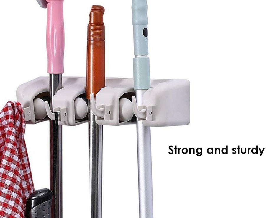 Space-saving mop and broom holder.