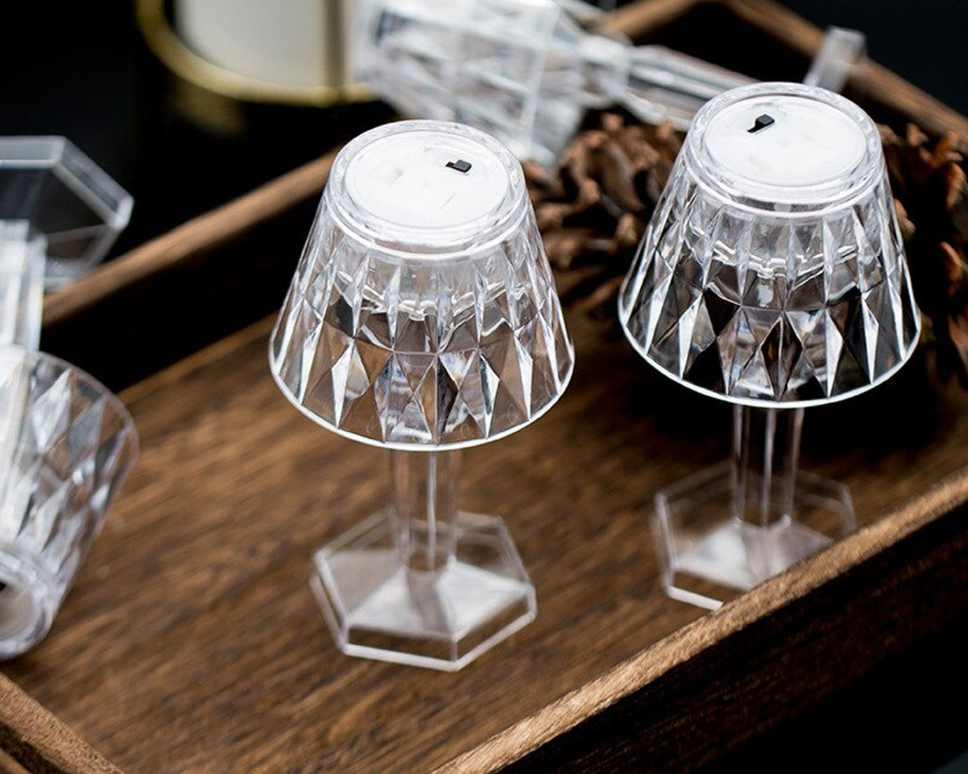 Transparent table lamp with crystal accents.