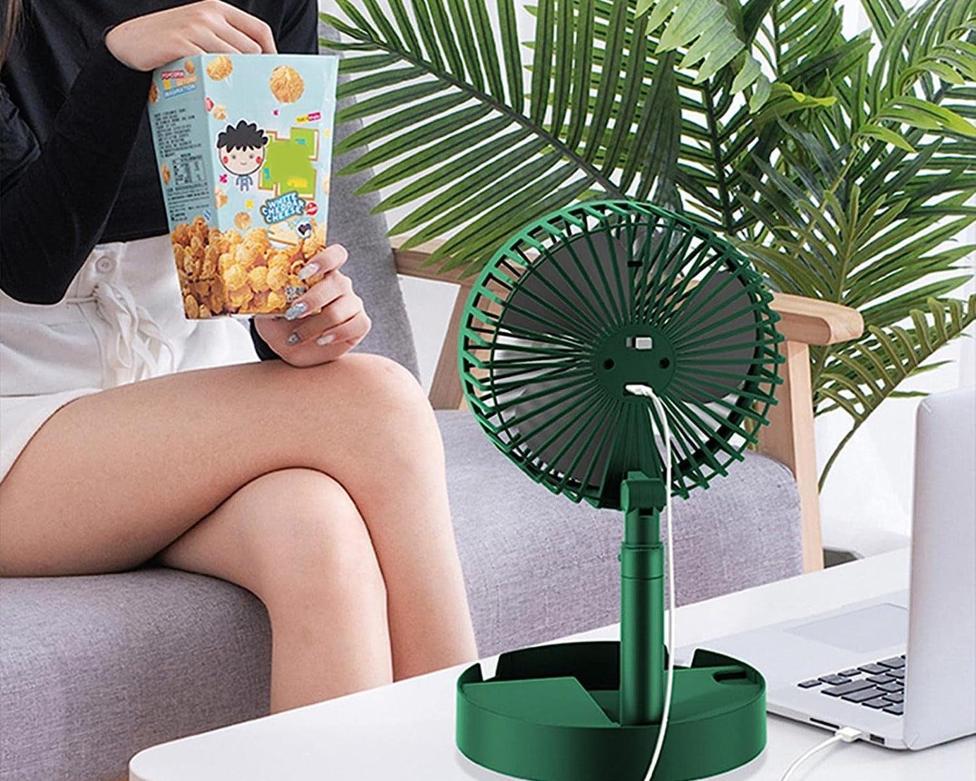 Electric fan with adjustable height and portability.
