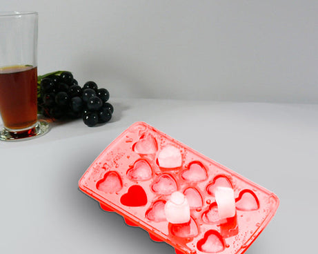 Heart-shaped silicone ice cube tray, enhances drink presentation.