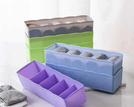Multi-colored bead storage tray with dividers, ideal for organizing small items.
