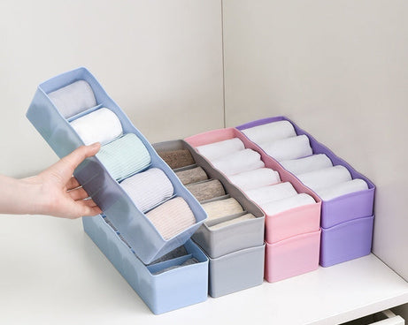 Plastic organizer with dividers, perfect for sorting beads and other small items.