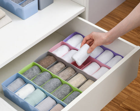 Clear plastic bead storage tray with multiple compartments for easy organization.