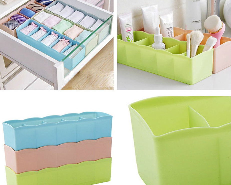 Multi-colored tray with clear plastic and dividers for organizing small beads.