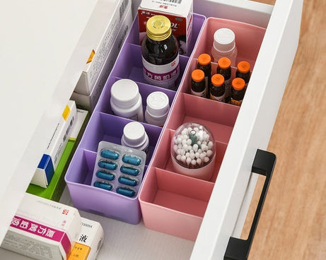 Clear bead storage tray with several compartments, showing multicolored sections.